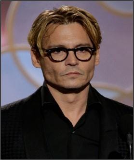 Johnny Depp wearing glasses at Golden Globe Awards
